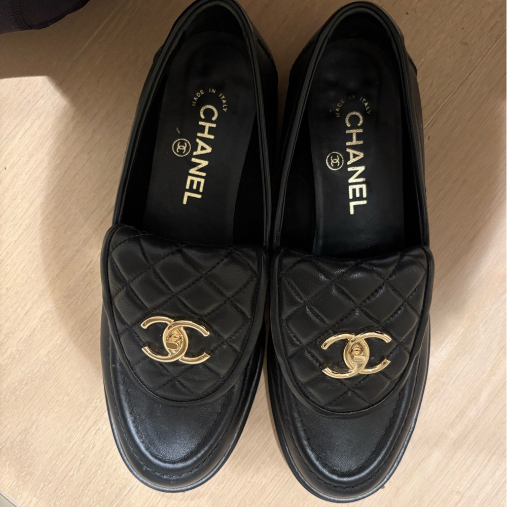 CHANEL Black Moccasins with Gold Logo